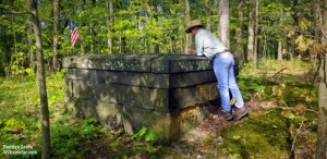David Sibray peers into the grave of Judge John Reddick, buried in both Virginia and Pennsylvania.