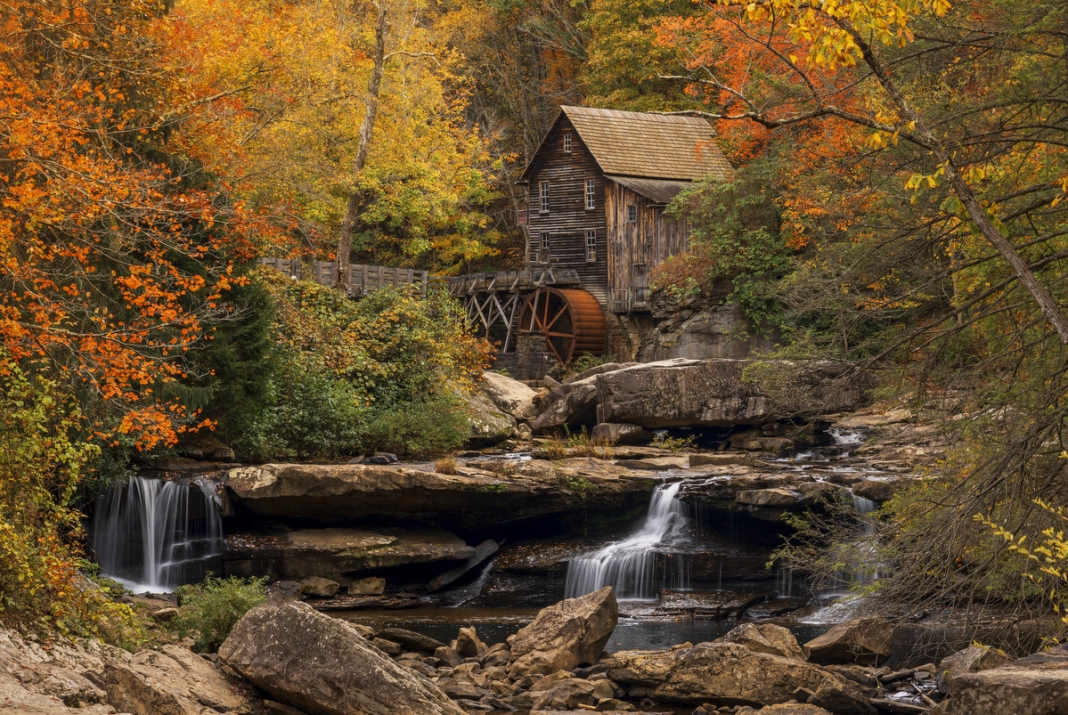 Glade Creek Gristmill at Babcock State Park Fall foliage surrounds the Glade Creek Gristmill at Babcock State Park in West Virginia.